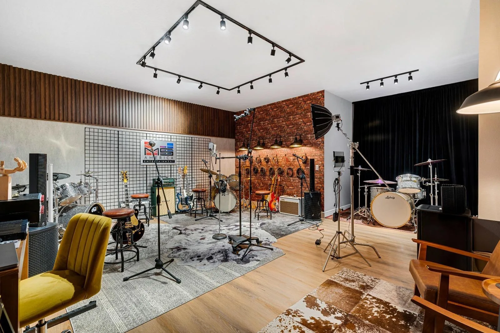 Full music studio with drums, guitars, amplifiers and recording lights